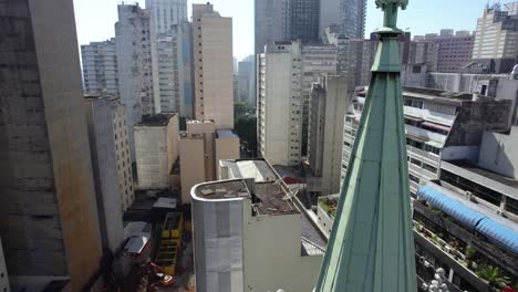 Aerial-view-rising-over-the-tower-of-the-Presbyterian-Church,-toward-the-Republica-district,-in-Sao-Paulo,-Brazil