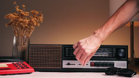old retro am fm radio with tubes, hand changing stations , bulb vintage music player.