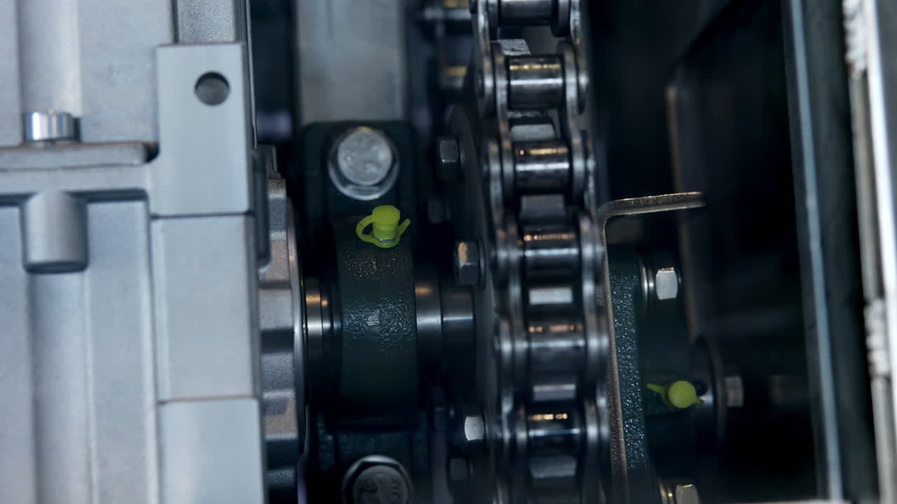 Close-up View of Industrial Gears and Chain Mechanism