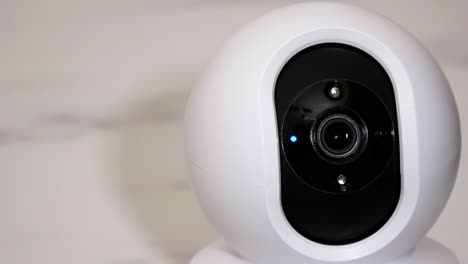 smartphone controlled home security camera moving filming around