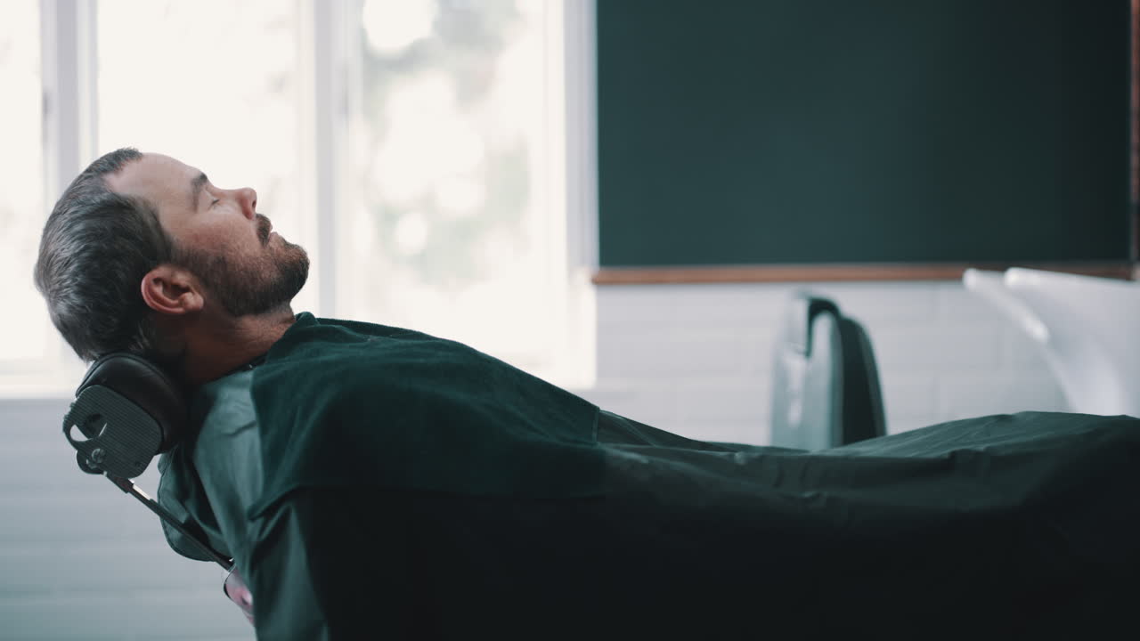 Man getting a haircut at a barber shop