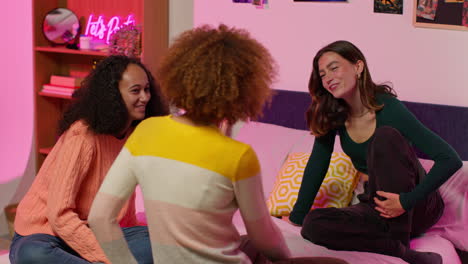 teenage girls hanging out in bedroom