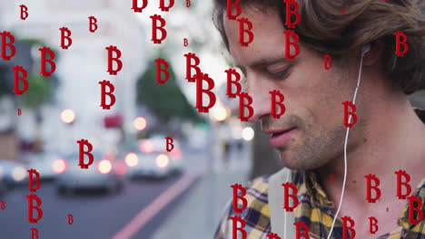 animation of red bitcoin over caucasian man playing song on cellphone and listening using headphones