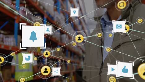 animation of network of connections with icons over man working in warehouse