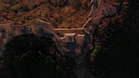 top aerial drone view of ancient castle ruins in takeda japanese mountain valley