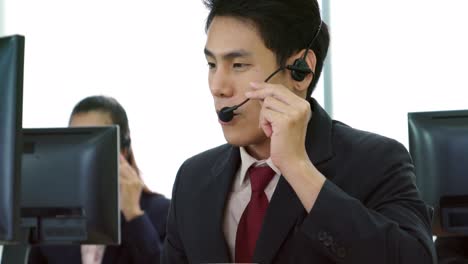 business people wearing headset working in office