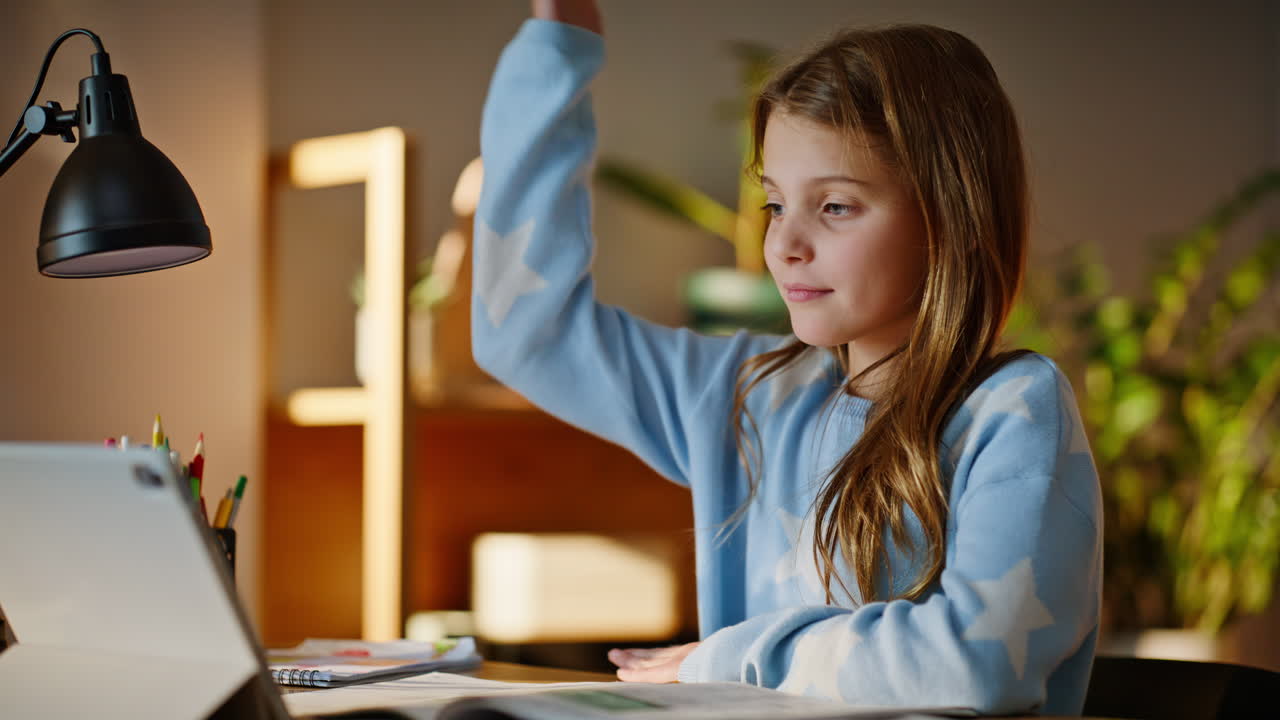 Schoolgirl have online lesson home looking tablet closeup. Smart school student