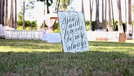 slide slow motion shot of a love quote painted on a wooden board