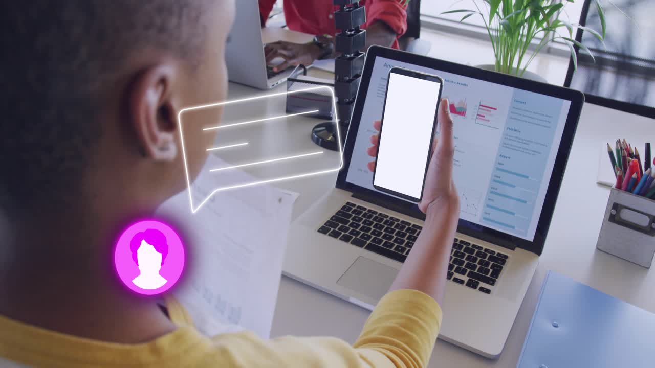 Woman holding phone over laptop, starting animated chat bubble and avatar showing messages for work