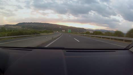 beautiful sunset and mountain line, while driving on the autobahn between thessaloniki and ioannina in the northwest region of greece through the pindos mountains