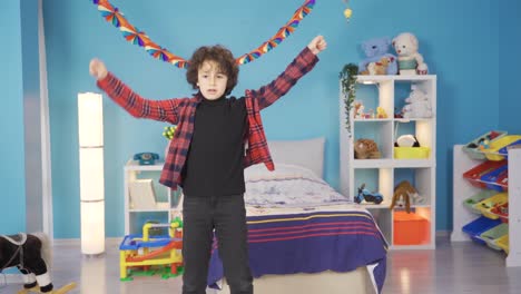 Cheerful-and-cute-boy-is-dancing-in-his-room.