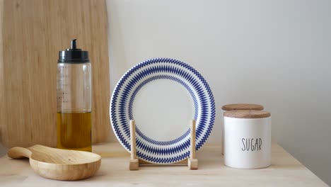 kitchen tableware with blue and white plate and sugar jar