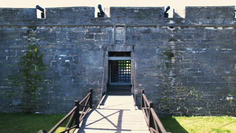 Aerial-view-in-front-of-the-gate-and-bridge-to-the-Castillo-De-San-Marcos,-in-St