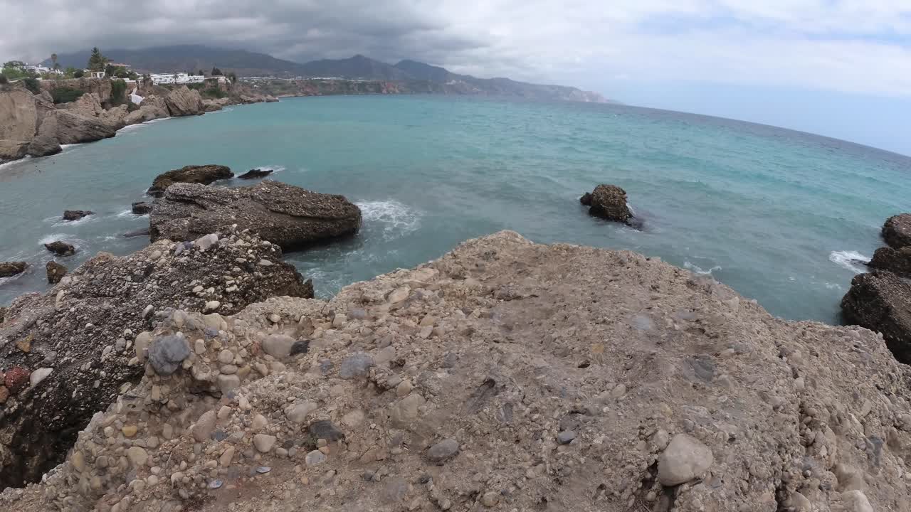 playa españa malaga nerja en un día nublado de verano usando un dron y una cámara de acción estabilizada-26