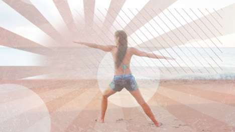 woman doing yoga at the beach