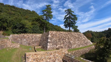 panning shot of tottori castle ruins on a clear day. japanese tourist attraction.