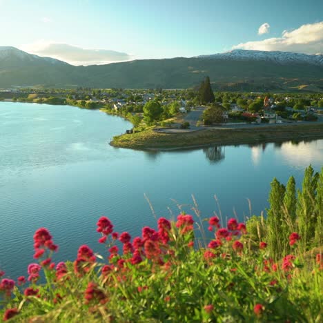 A-scenic-lake-surrounded-by-flowers-and-mountains-is-seen-in-Reykjavik-Iceland