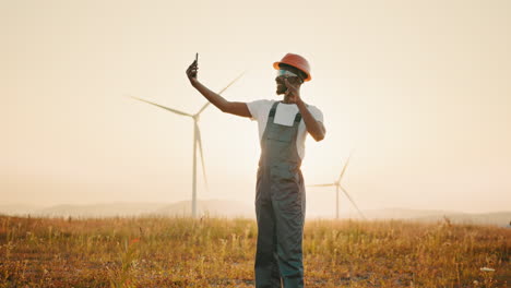 engineer taking selfie at wind farm