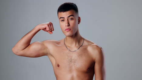 shirtless man flexing