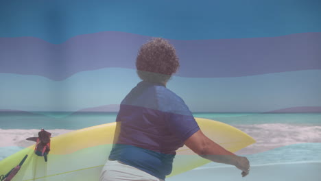 carrying yellow surfboard, person heading to ocean waves under clear sky