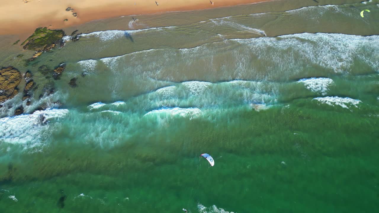 Seen from above kitesurfers near the coast with the waves breaking,Cascais,Portugal