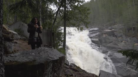 girl looking at a big waterfall