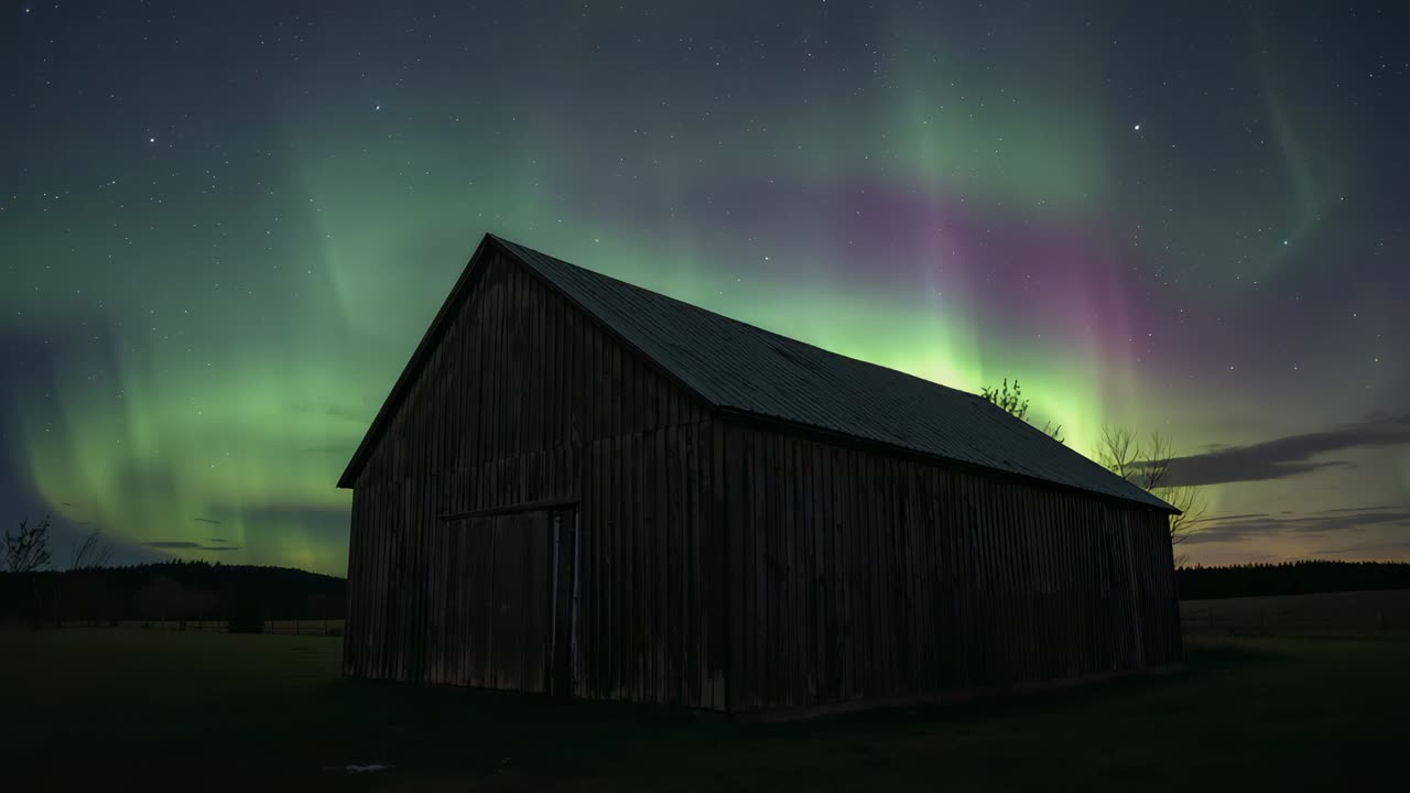 Rising auroral curtains sweeping night sky behind weathered wooden barn at rural field, with stars