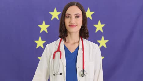female doctor making ok gesture in front of eu flag