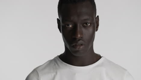 serious african american man on grey background.