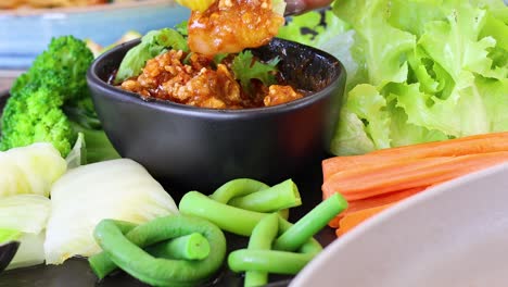 arranging vegetables around a bowl of dip