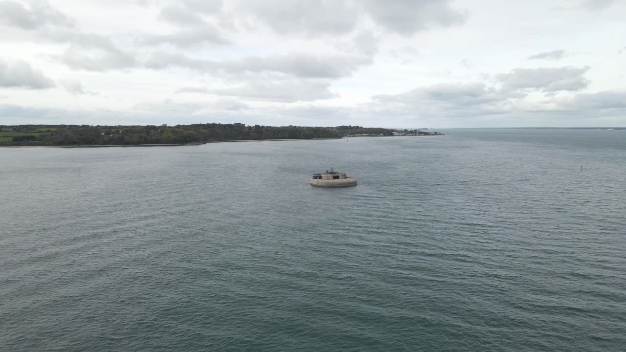 Aerial view St Helens Fort, sea fort in the Solent close to the Isle of Wight, was built as result of the Royal Commission on the Defence of the United Kingdom of 1859, drone rotating to the left