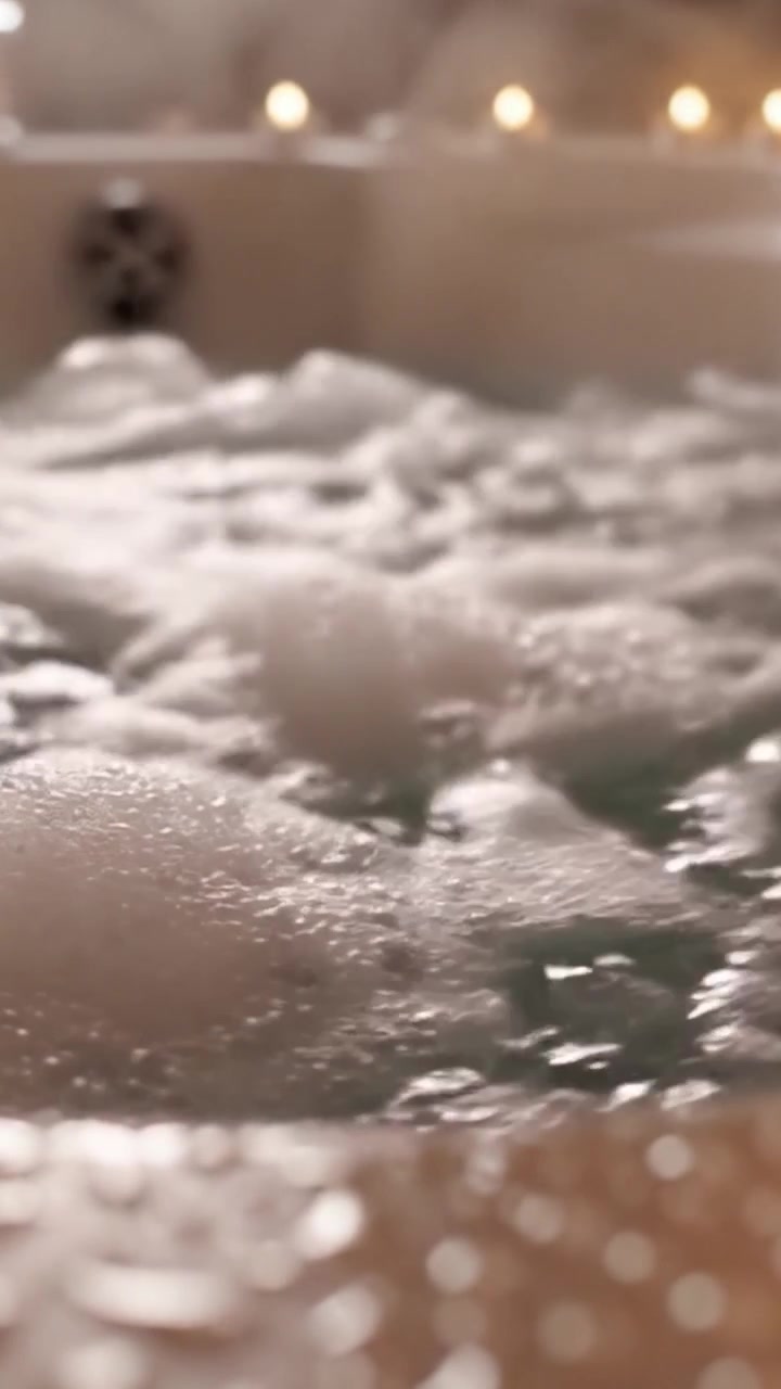 Relaxing Spa Experience: Indulge in the Serenity of Soothing Bubbles and Warm Water in a Luxurious Bathtub Setting, Perfect for Unwinding After a Long Day