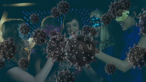 digital composite video of covid-19 cells moving against group of friends at masquerade party