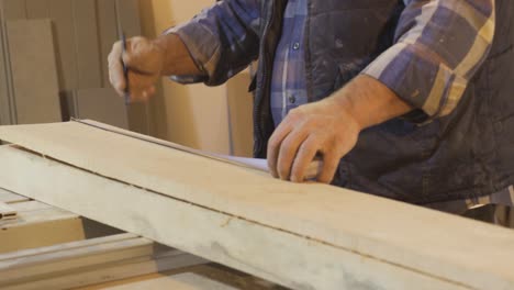 close-up hands of male carpenter.