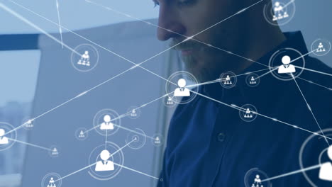 animation of network of connections with people icons over biracial businessman in office