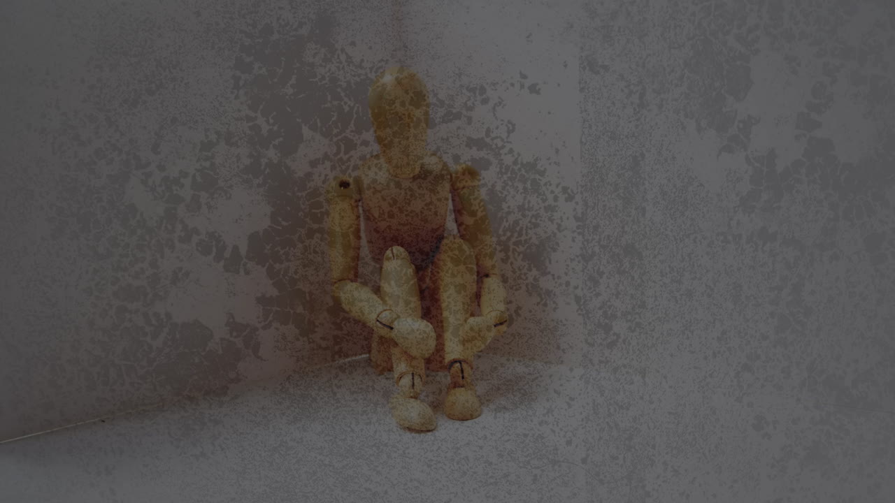 Textured scratched overlay against stressed wooden figurine with copy space on grey background