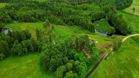 Aerial View of Lush Green Forest, River, and Fields