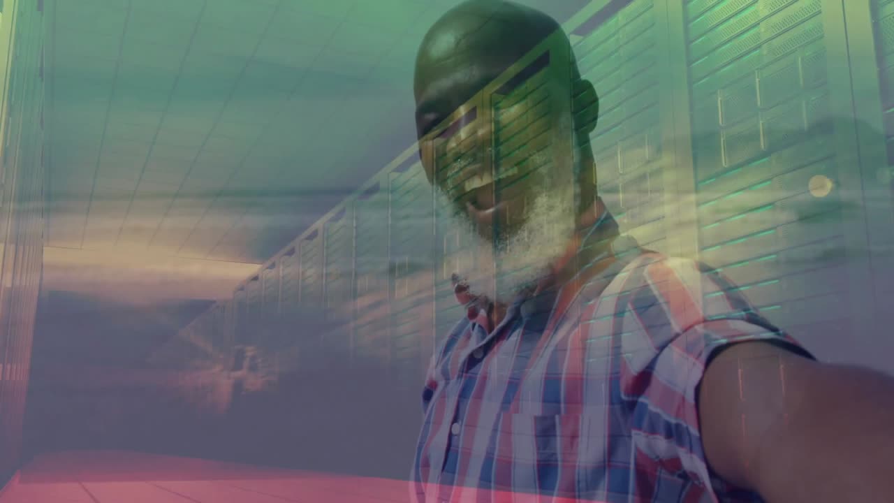 Man holding smartphone taking selfie in data center, showing animated server racks with sun rays