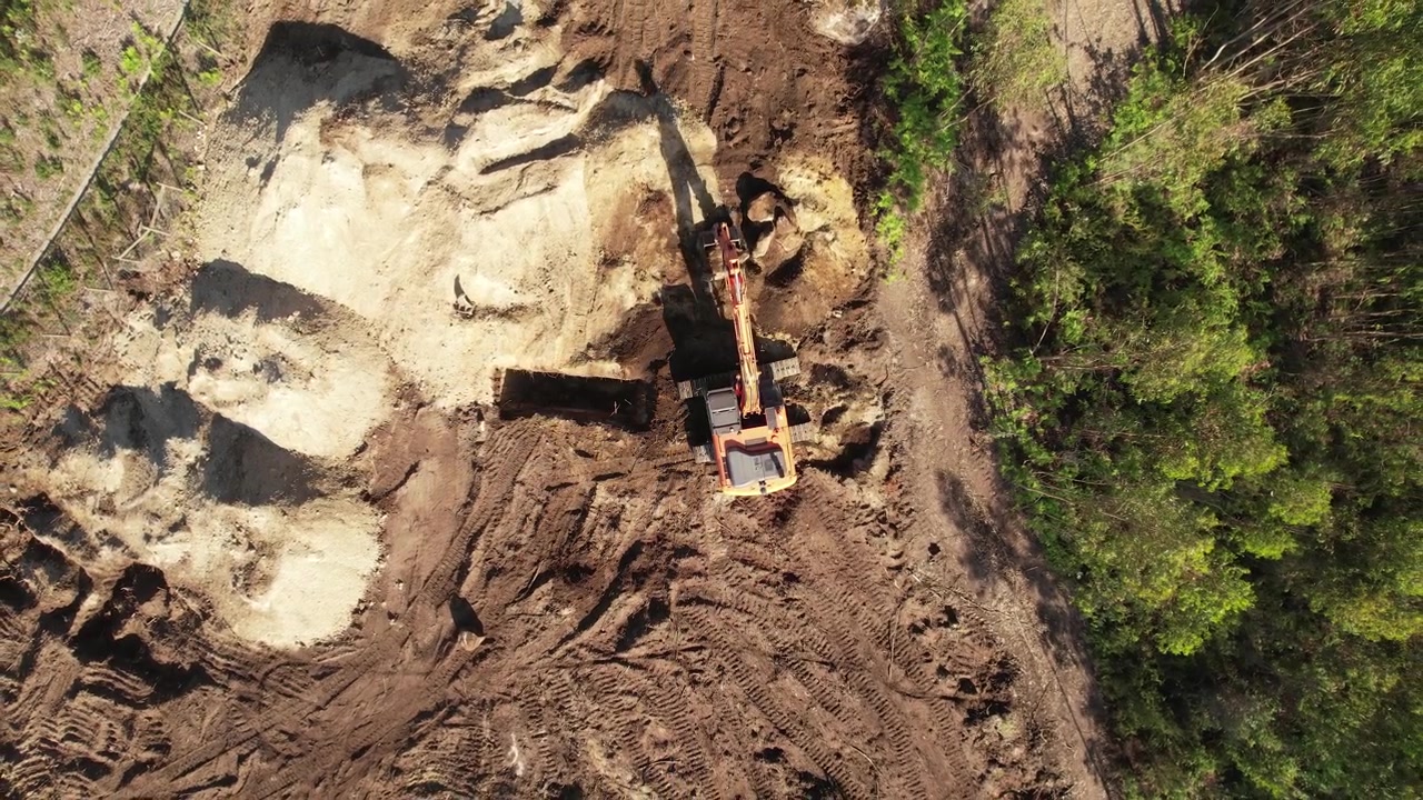Top View of an excavator operating on a hillside