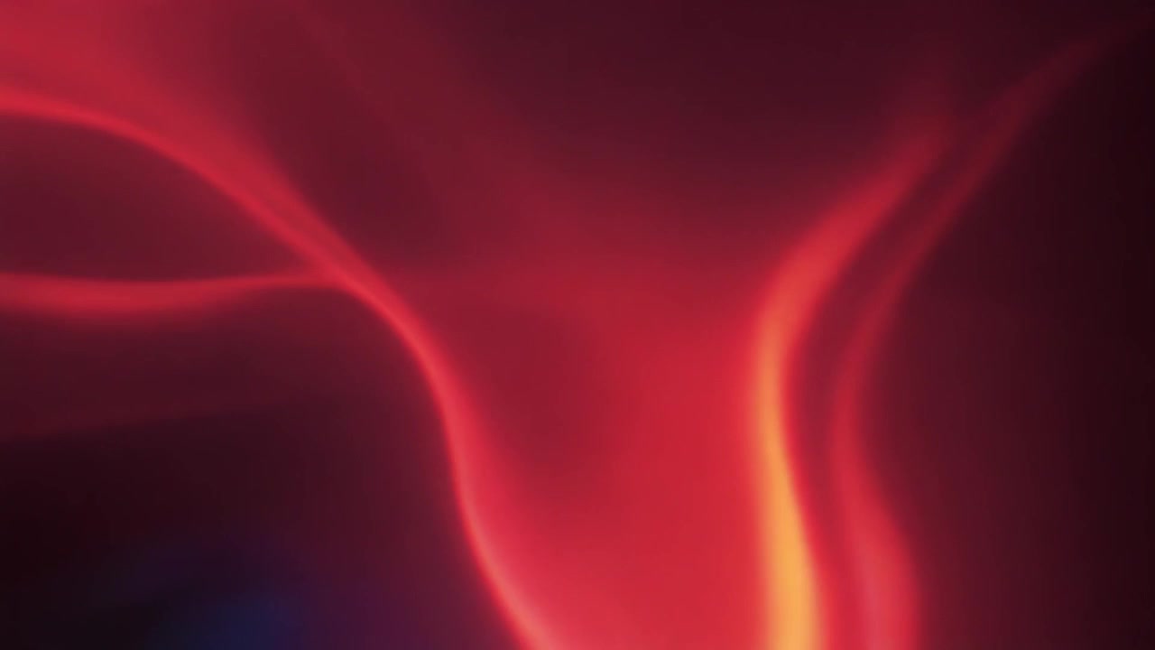 Abstract Red Smoke Swirling Against Dark Background