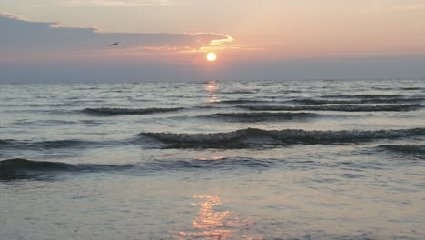 sunset over the ocean waves