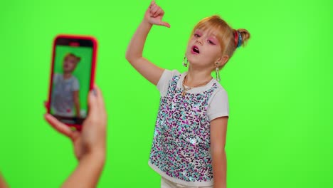 stylish kid girl making trendy dance video for social media network, child dancing, funny blogger