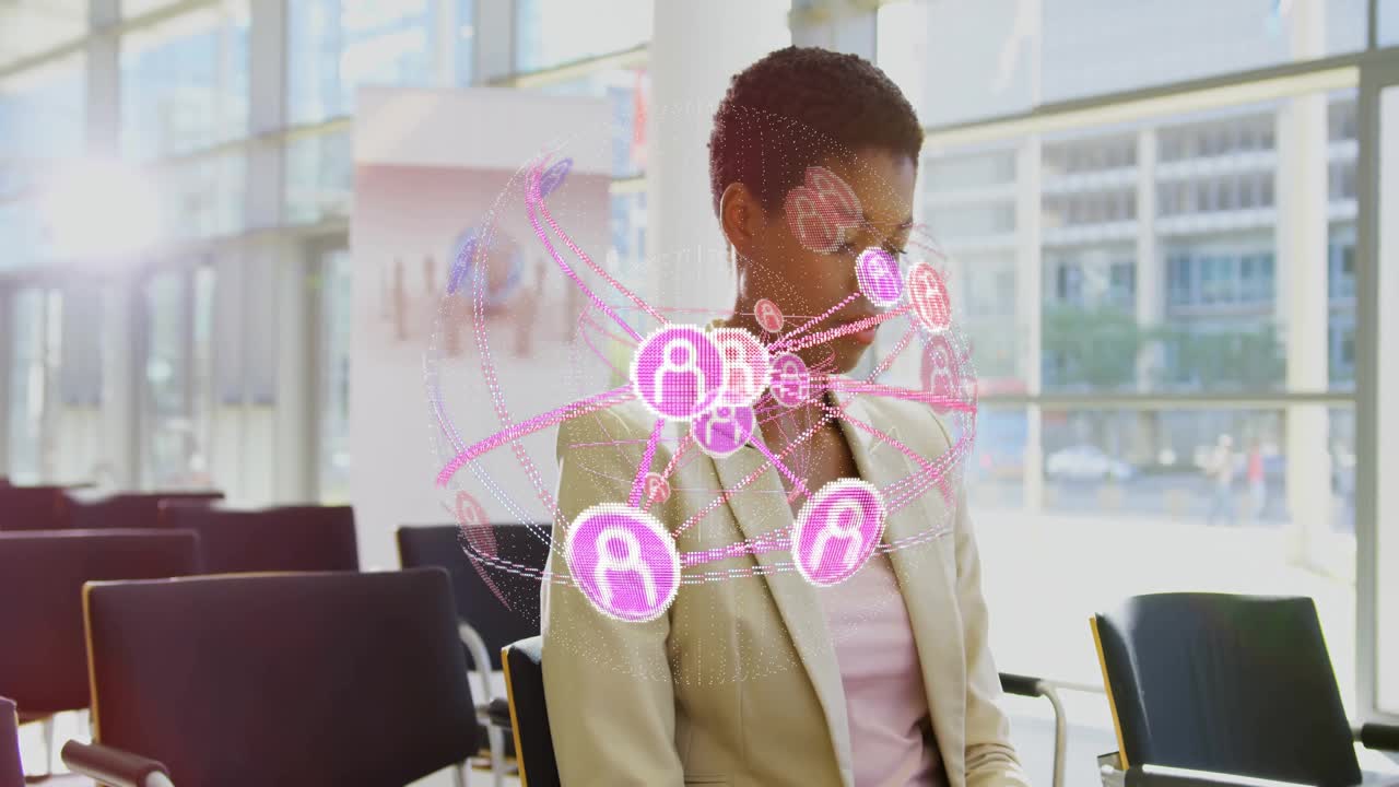 Business woman sitting in office, interacting with holographic network sphere and pink icons