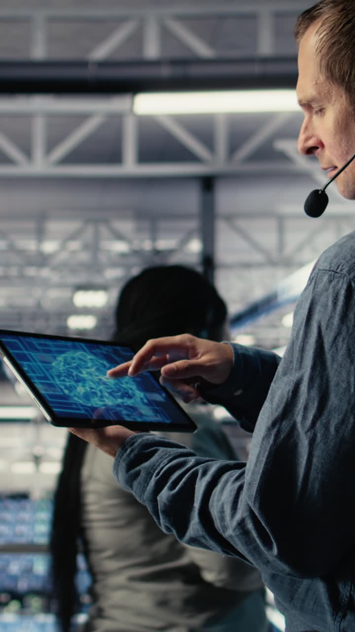 Vertical Video Data Center Engineer Using Ai On Tablet To Help Clients Resolve Hosting Problems
