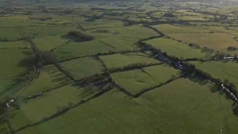 Patchwork-fields-english-countryside-daytime-drone-shot