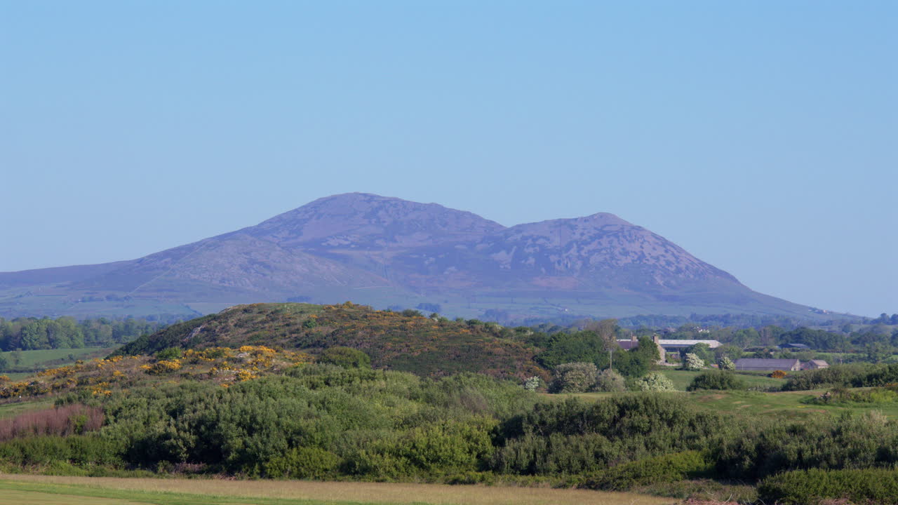 Long shot of yreifl Mountains at Hafan y Môr on Pen-y-chain, Pwllheli