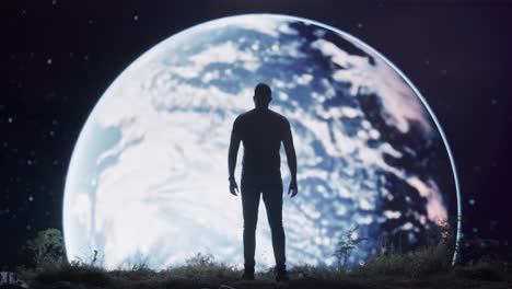 man contemplating earth at night