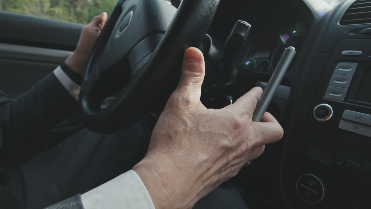 Man Using Hand Controls to Drive Car