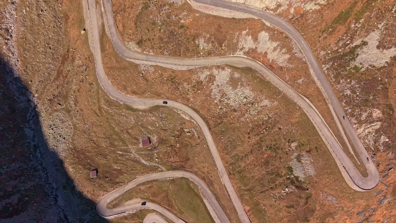 Winding Tremola Road through the Alps, captured from an elevated drone
