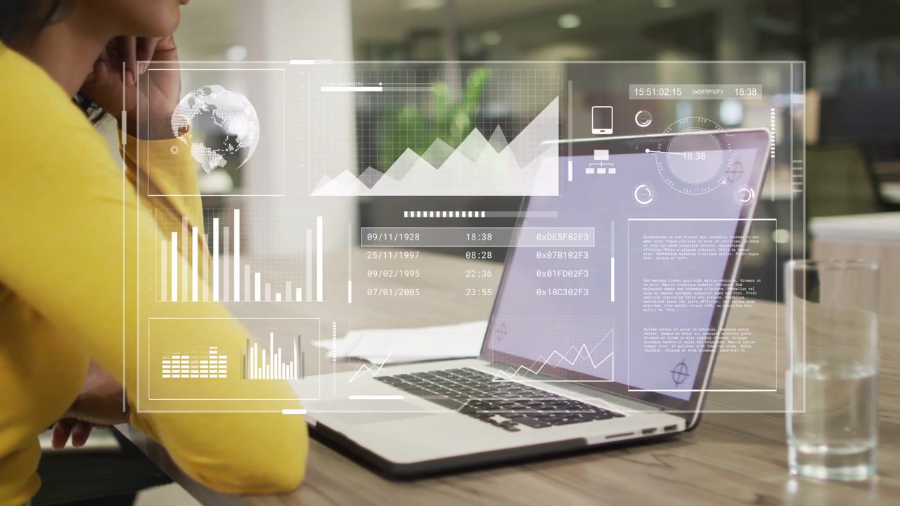 Woman sitting with chin resting and viewing laptop causing IT HUD charts morphing into globe dials